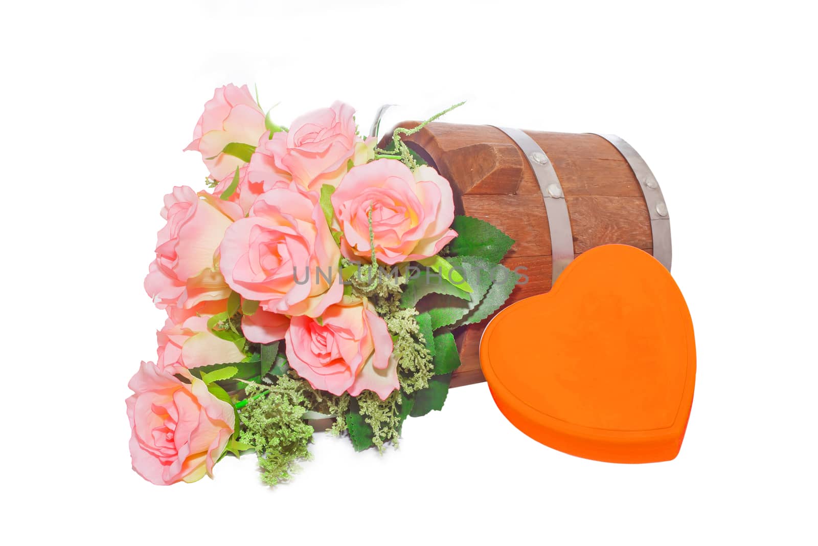 Summer flowers in wooden bucket and orange heart  on white background
