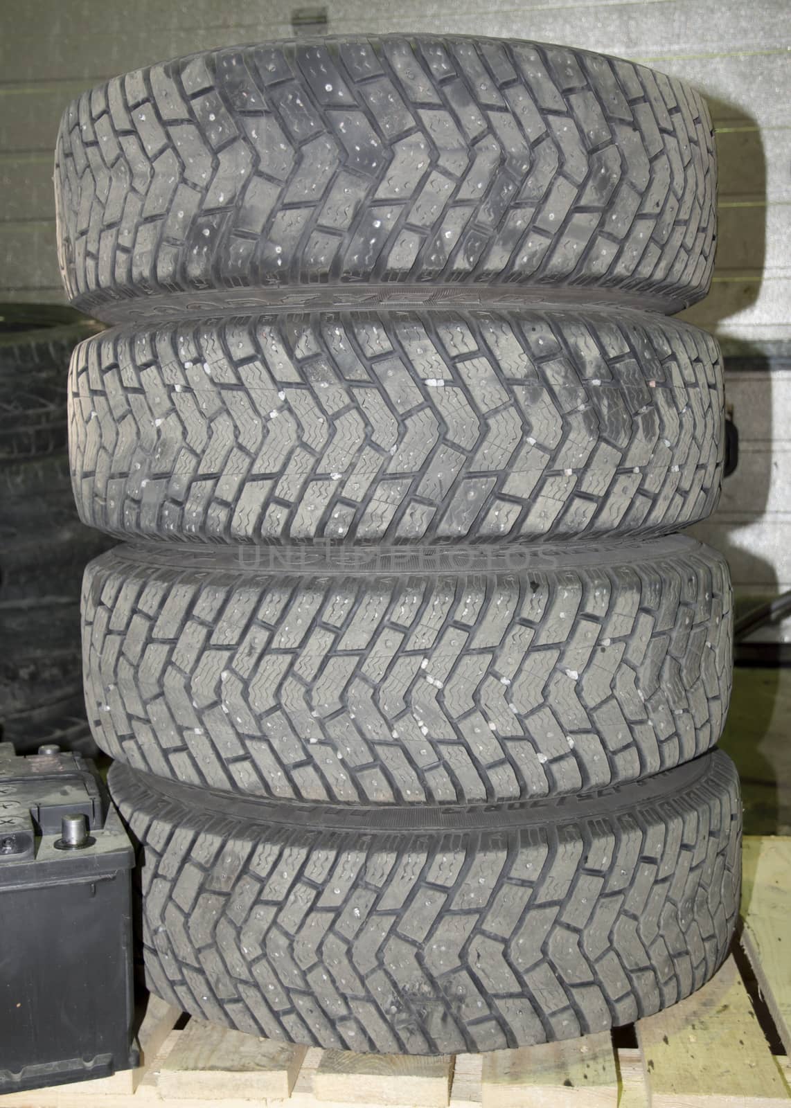 Pile of summer tires. Car mechanic garage switch to or from summer or winter tires in April or October.