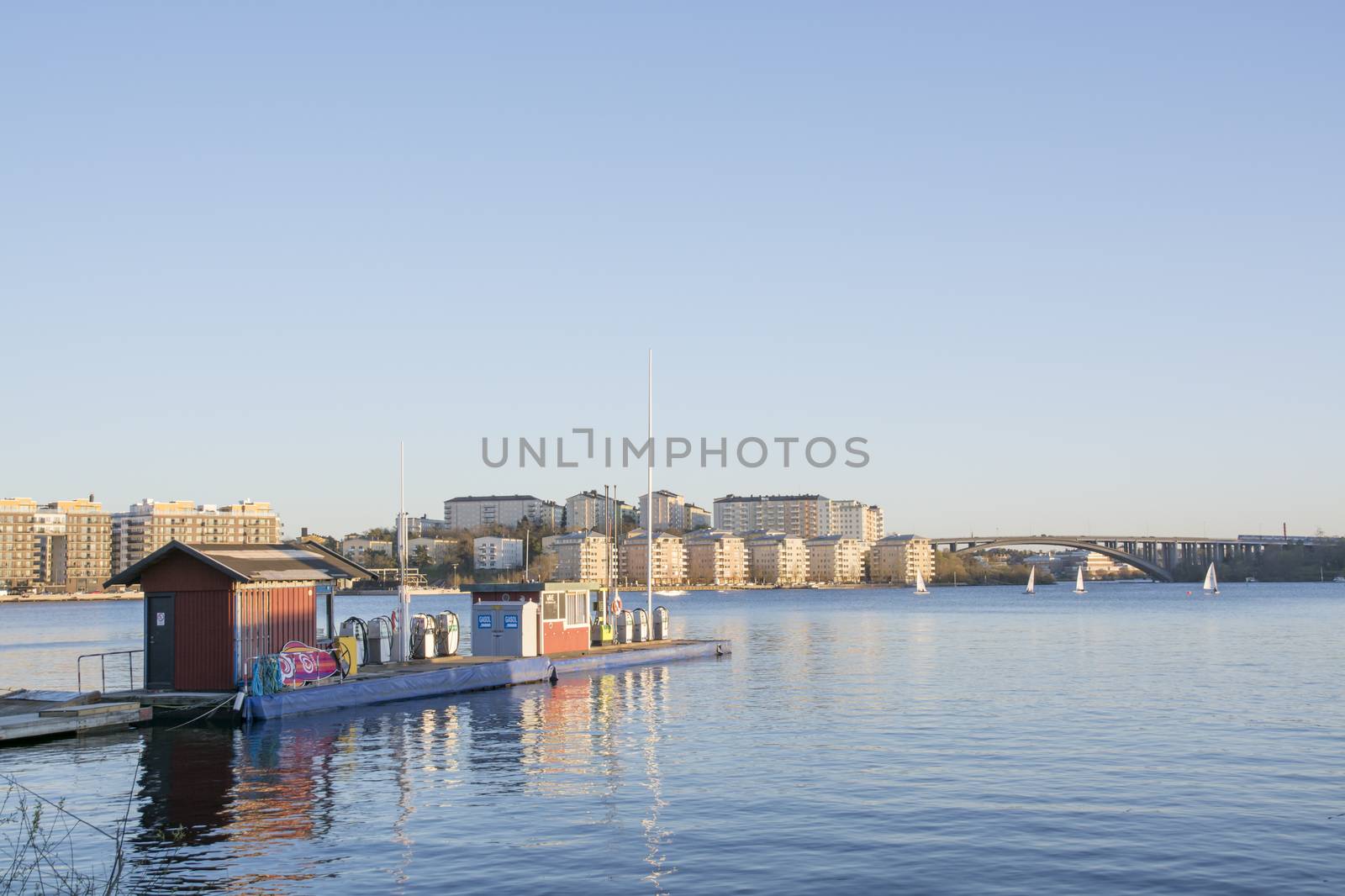 SOLNA, STOCKHOLM, SWEDEN ON APRIL 29, 2014: Gas station with a view over the lake and new residential area Hornsberg on April 29 2014 near Pampas Marina in Solna, Stockholm, Sweden.