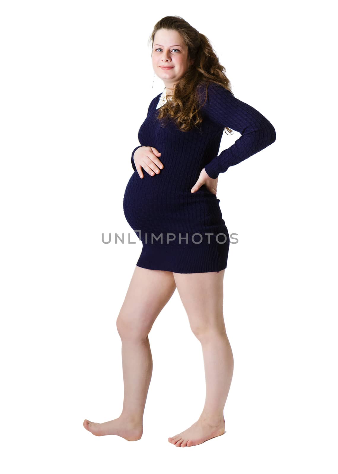 Young pregnant woman standing in full length. Isolated on white background