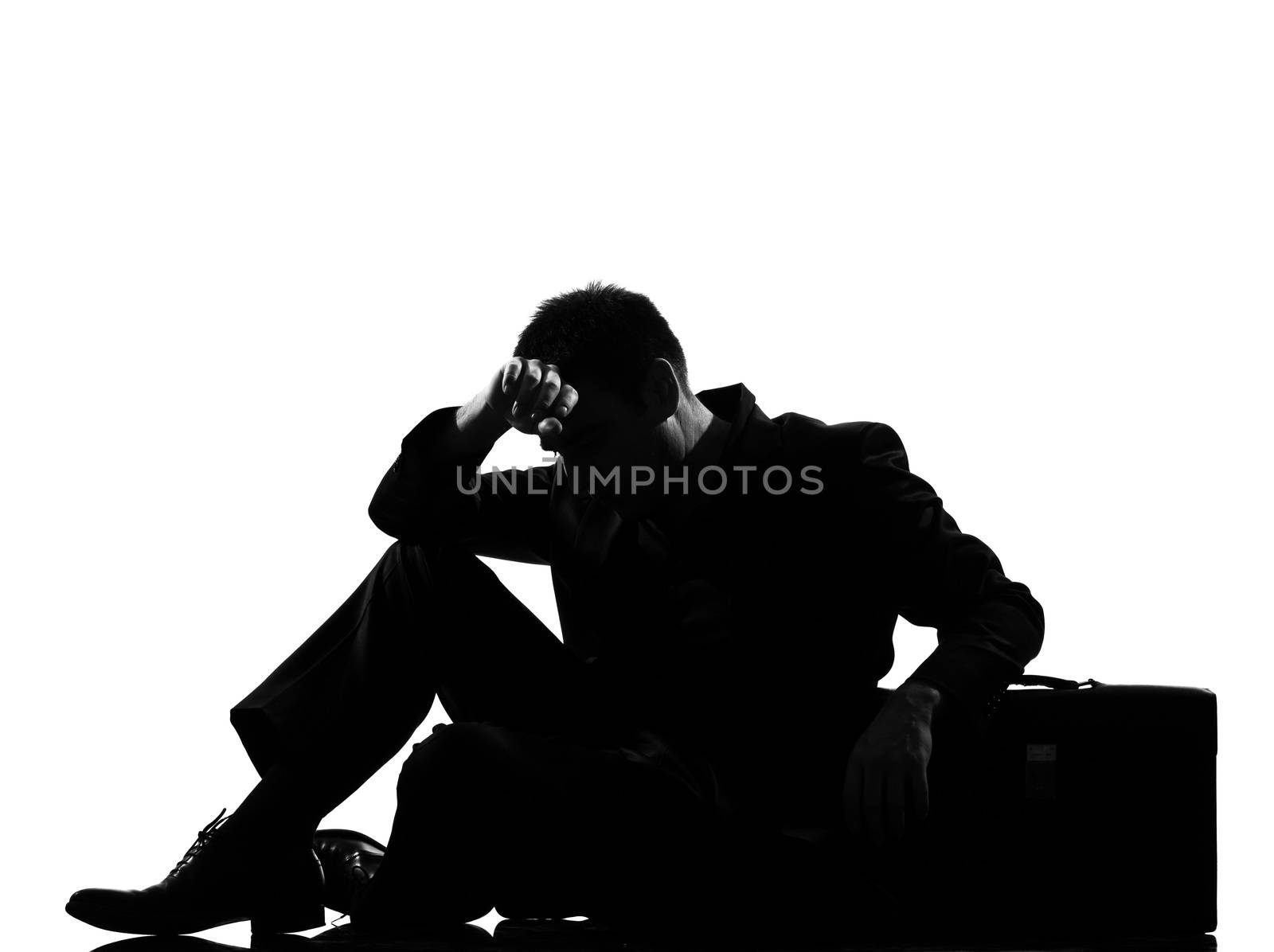 silhouette  business man expressing fatigue despair tired behavior briefcase full length on studio isolated white background