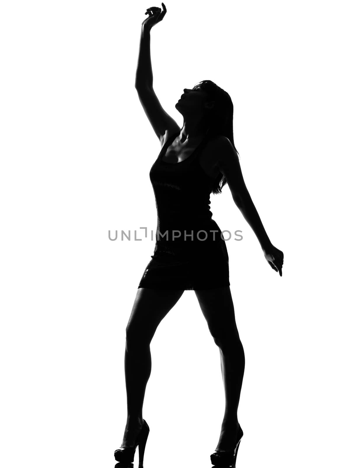 stylish silhouette  beautiful woman dancing full length on studio isolated white background