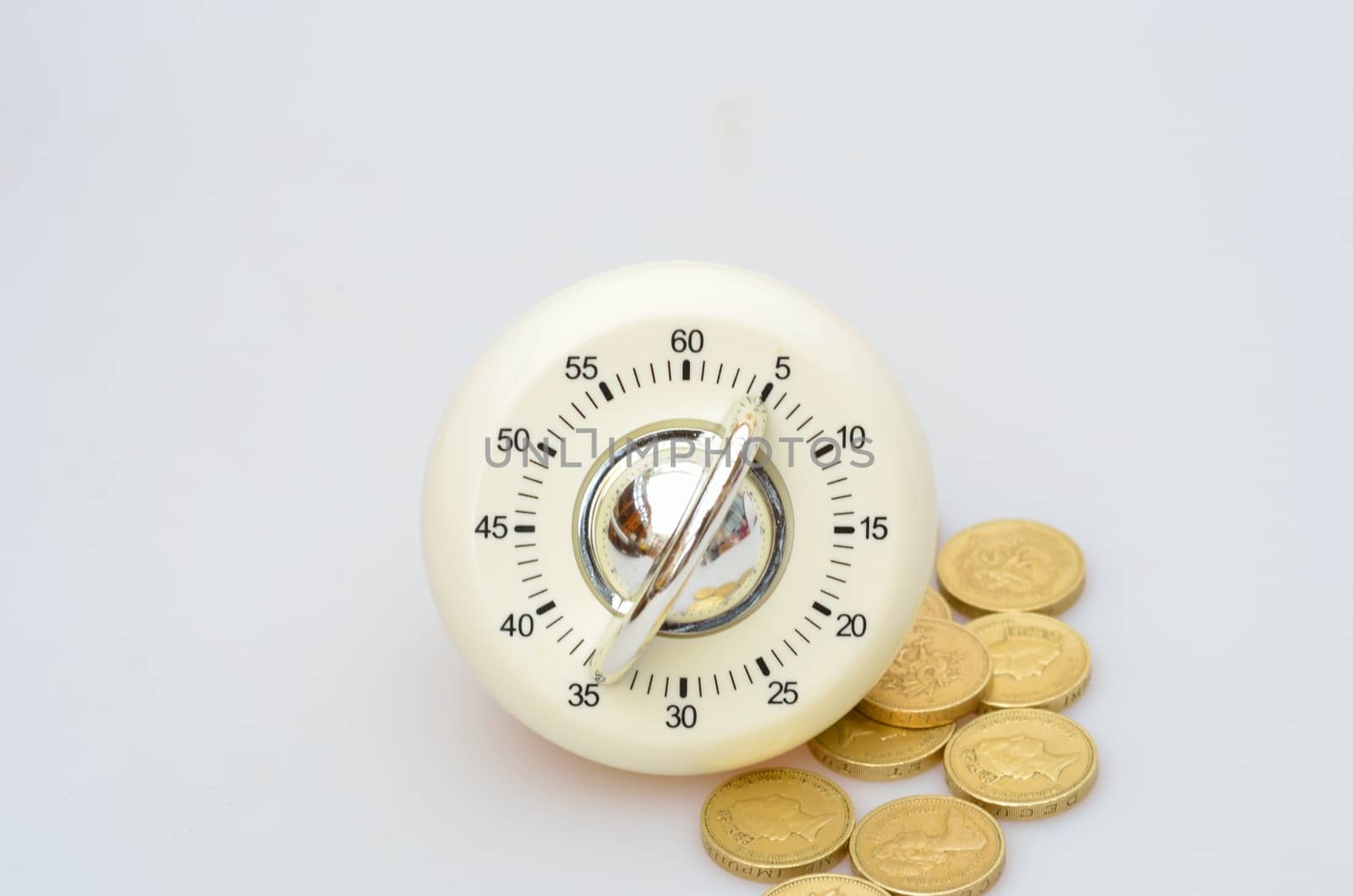 Kitchen timer and coins by pauws99