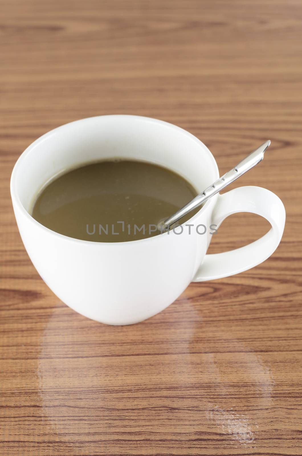 coffee in cup on wood background