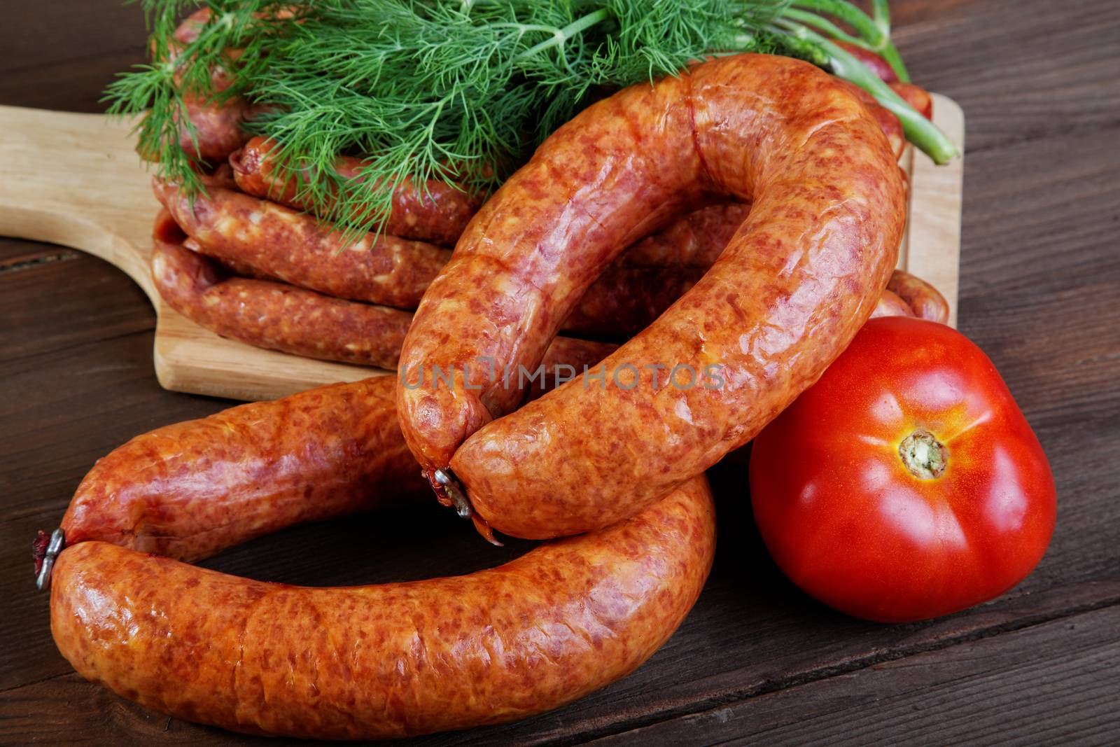 Smoked sausage on a kitchen table by alarich