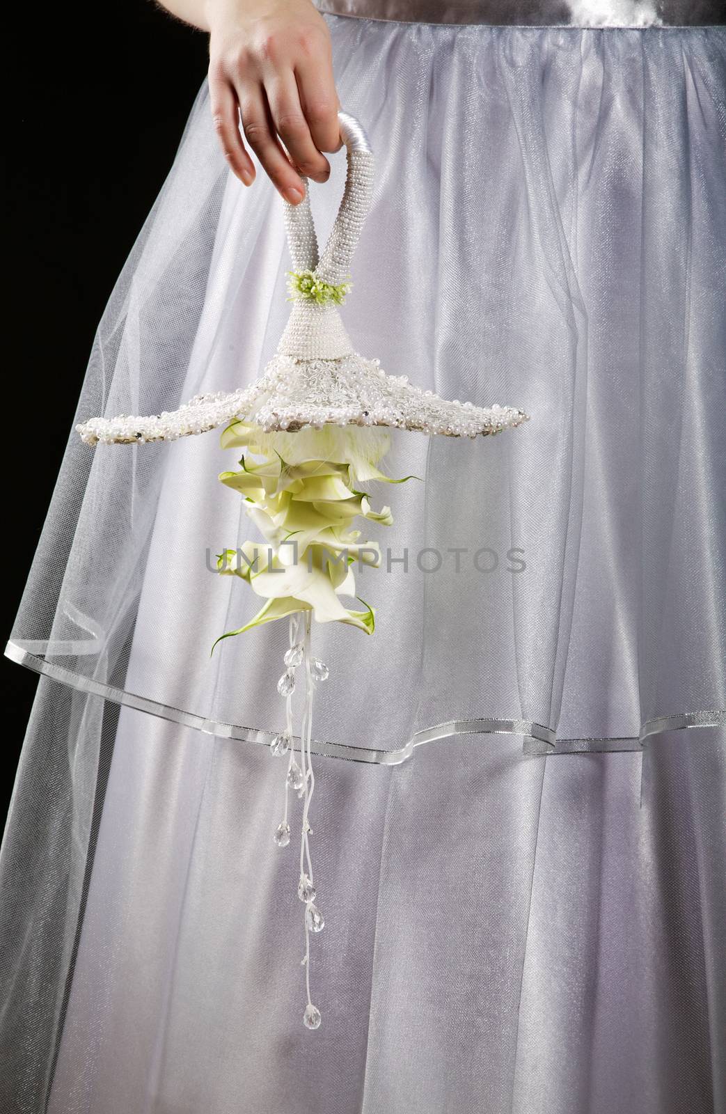 Wedding bouquet close up in hands at the bride