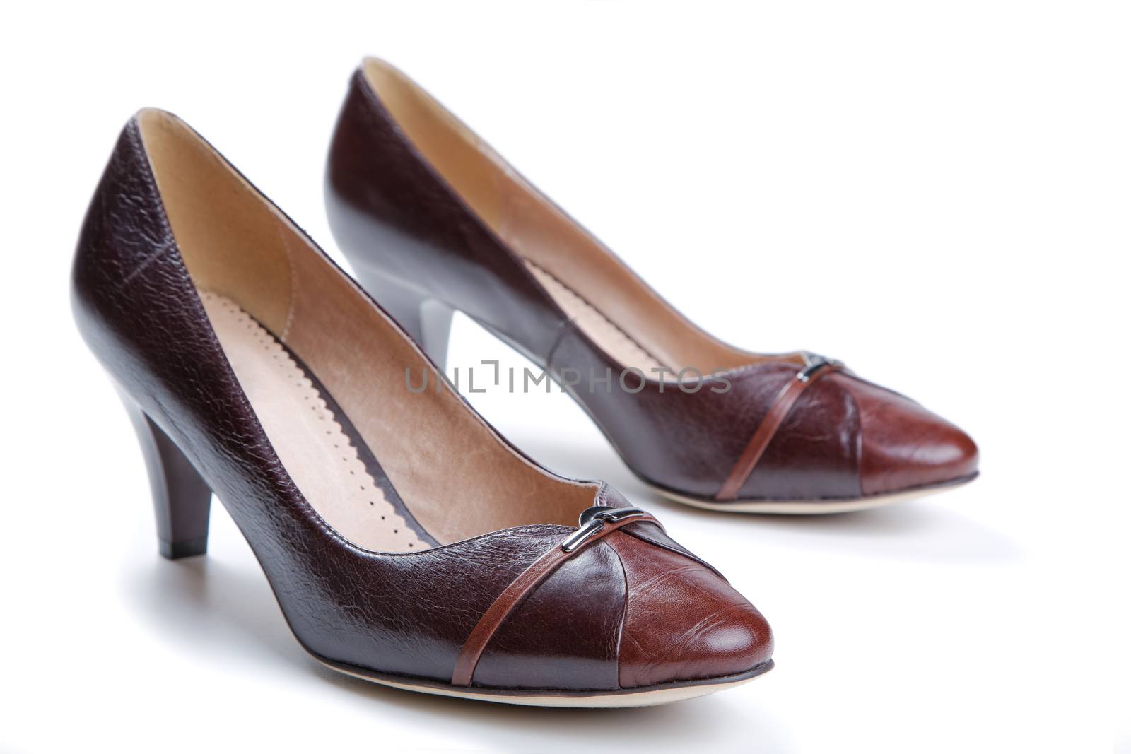 Brown female shoes isolated on a white background