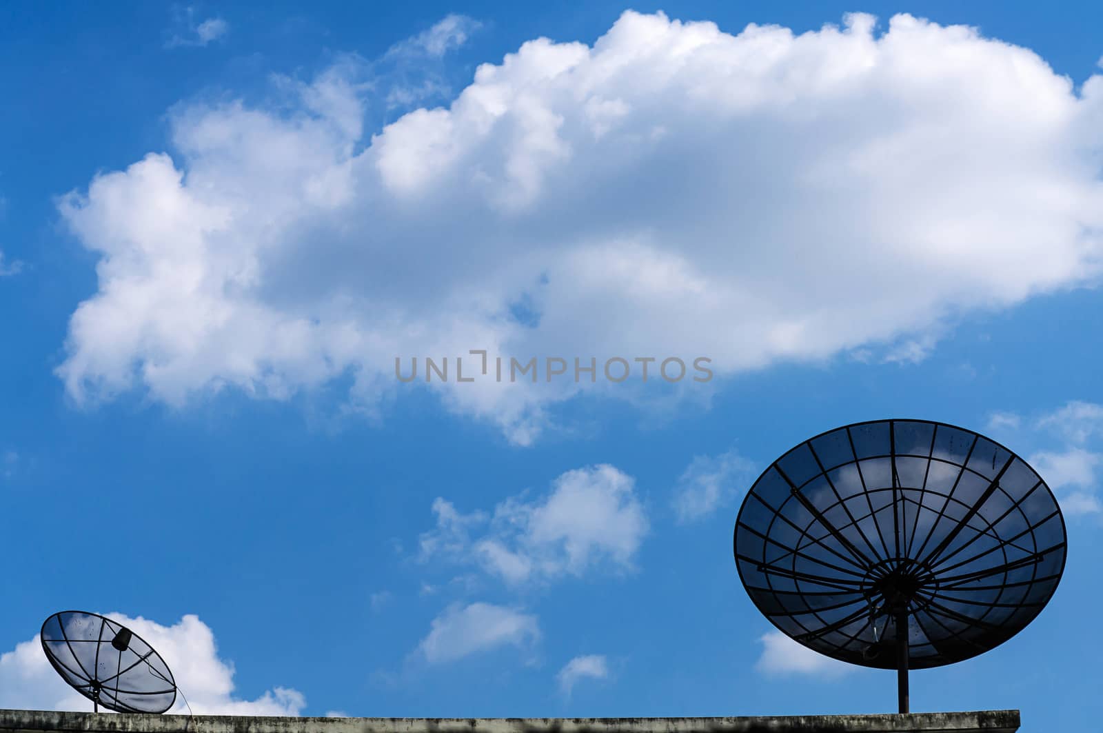 Satellite dish antenna on blue sky with cloud