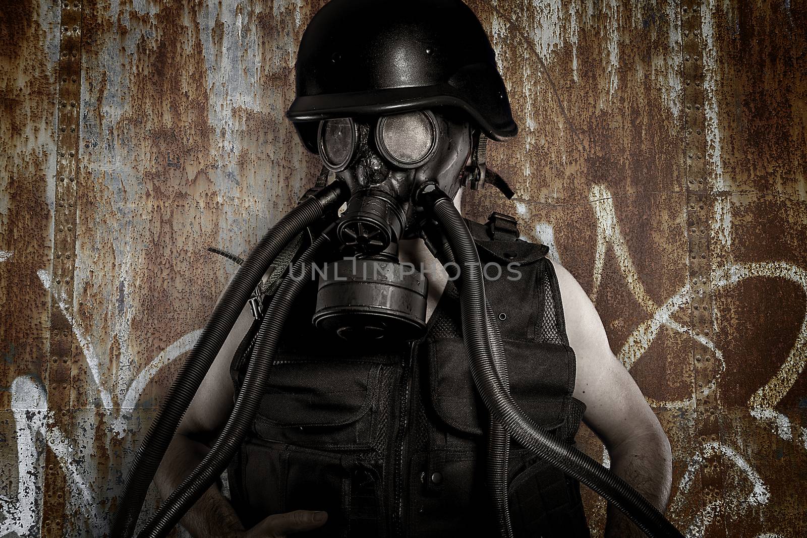 Man with gas mask over dirty texture iron wall by FernandoCortes