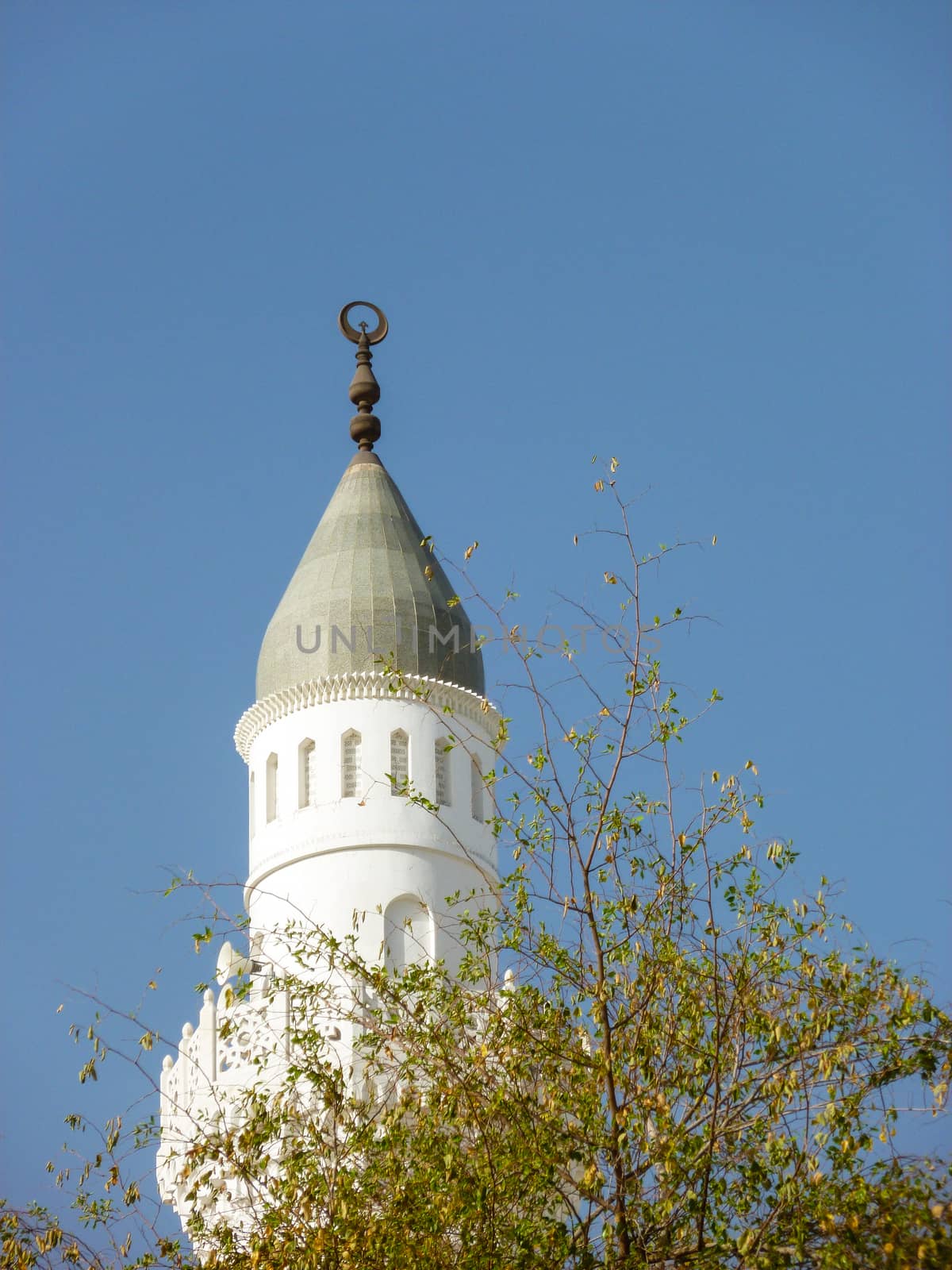Minaret of Quba mosque with blue sky background