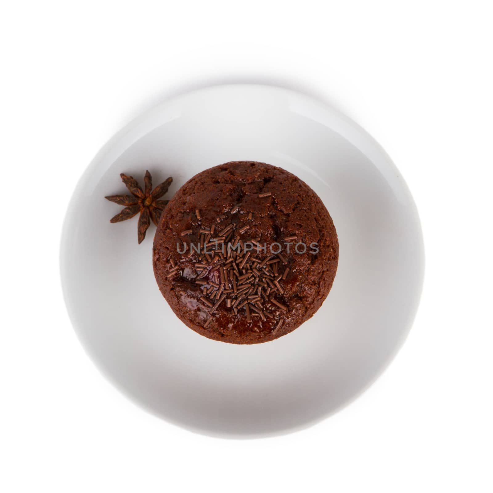 Chocolate muffin on a white plate isolated on white background