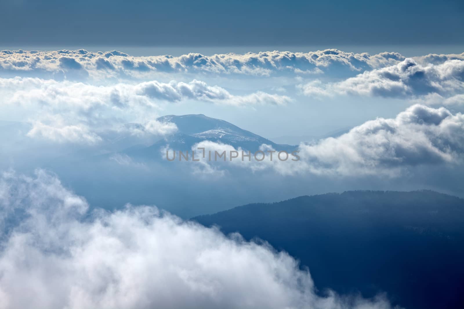 Misty mountain landscape above the clouds