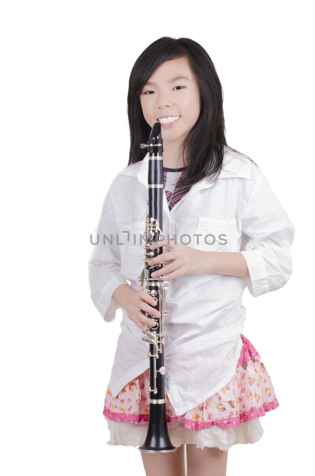 Beauty girl blowing instrument on white background