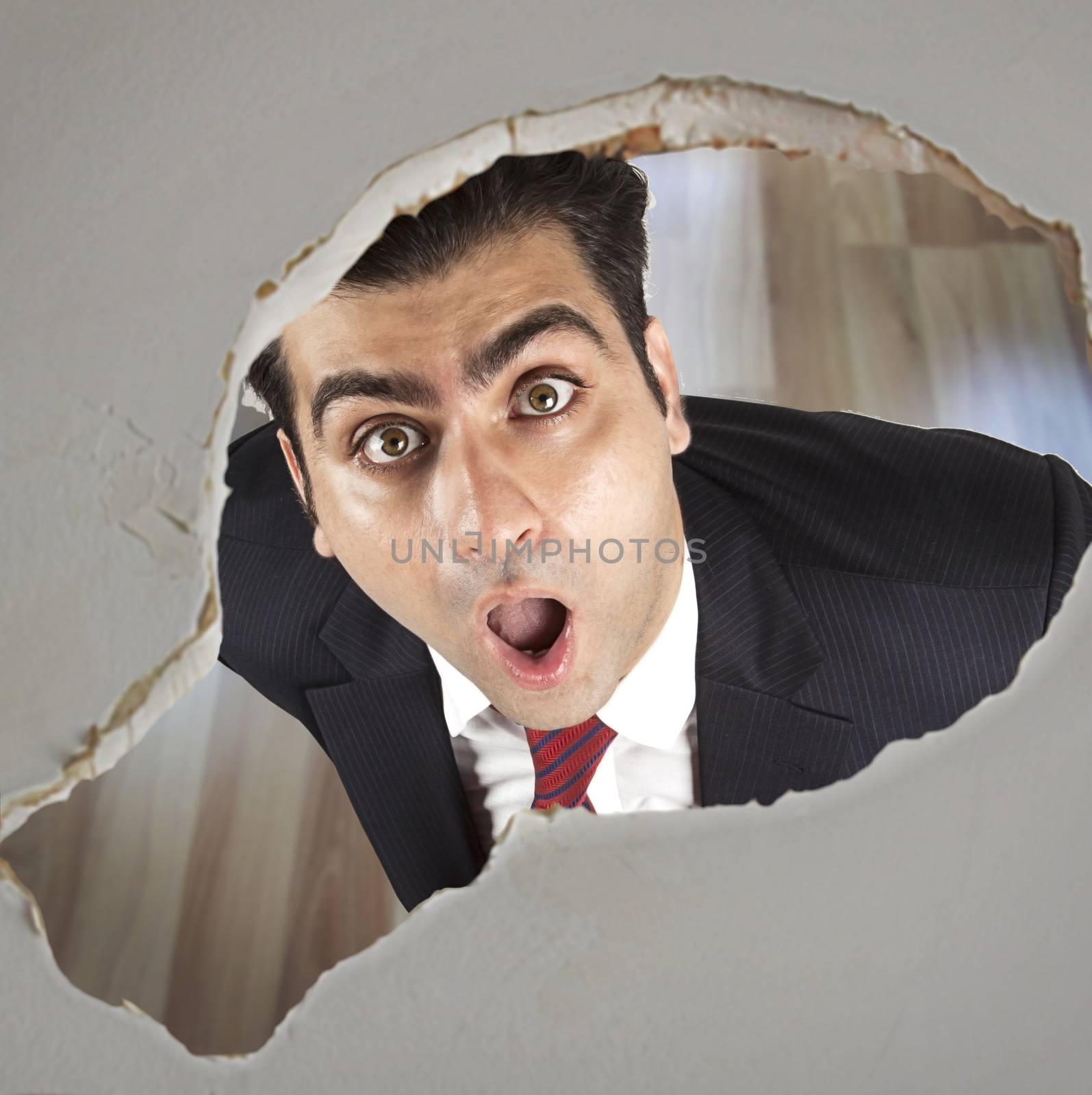 Man looking through a hole in the ceiling  by haiderazim