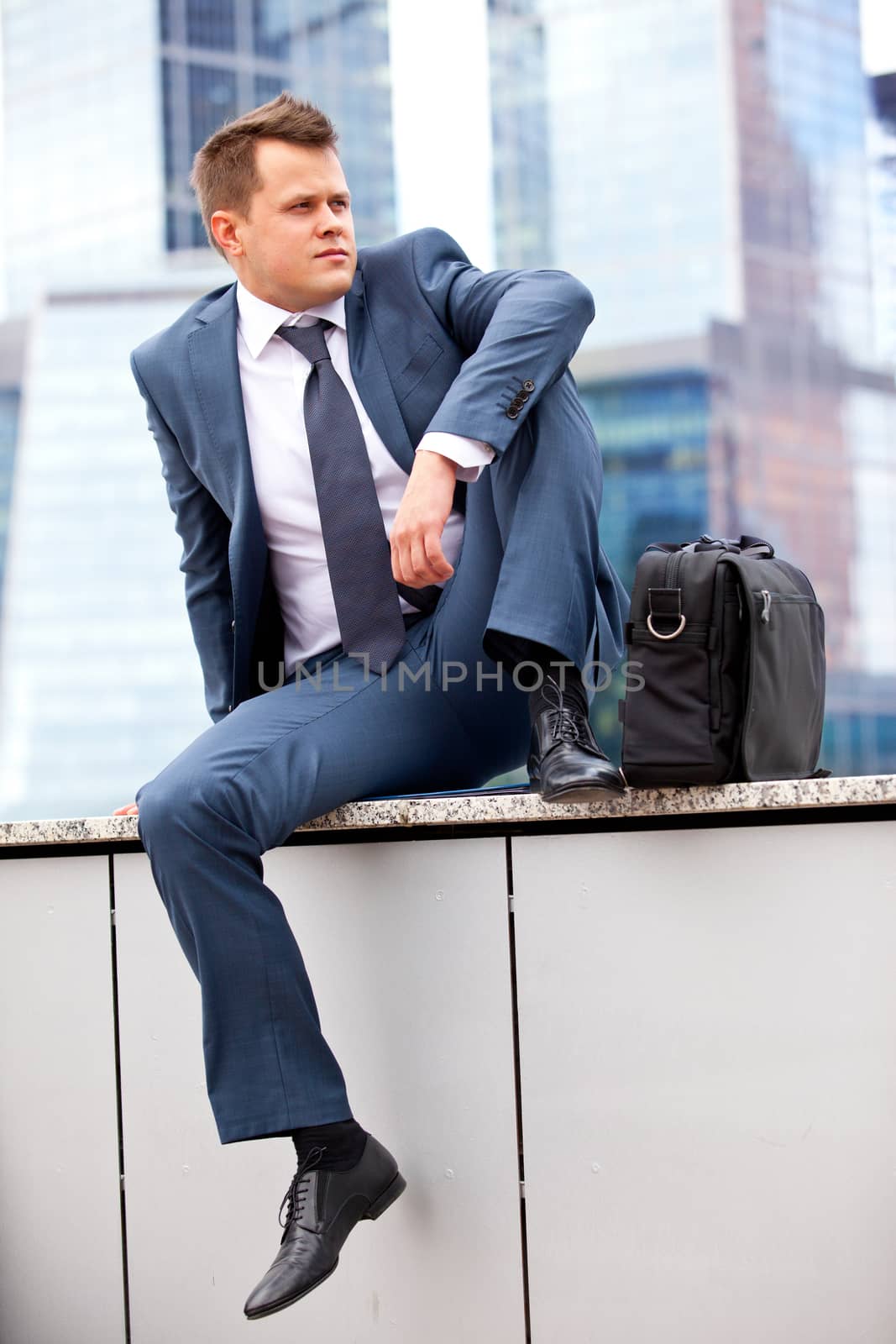 successful businessman resting by Astroid