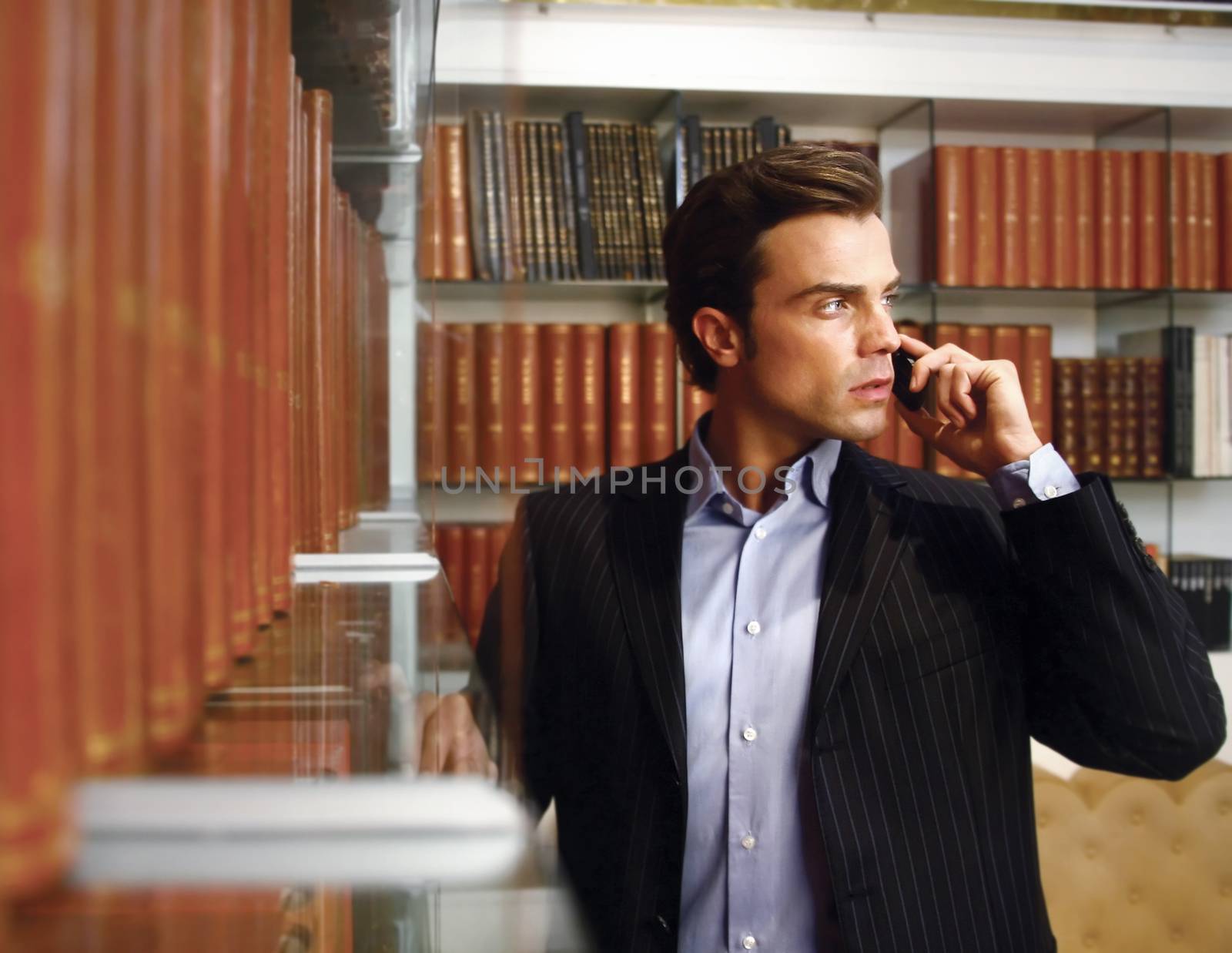 A handsome business man at his company office