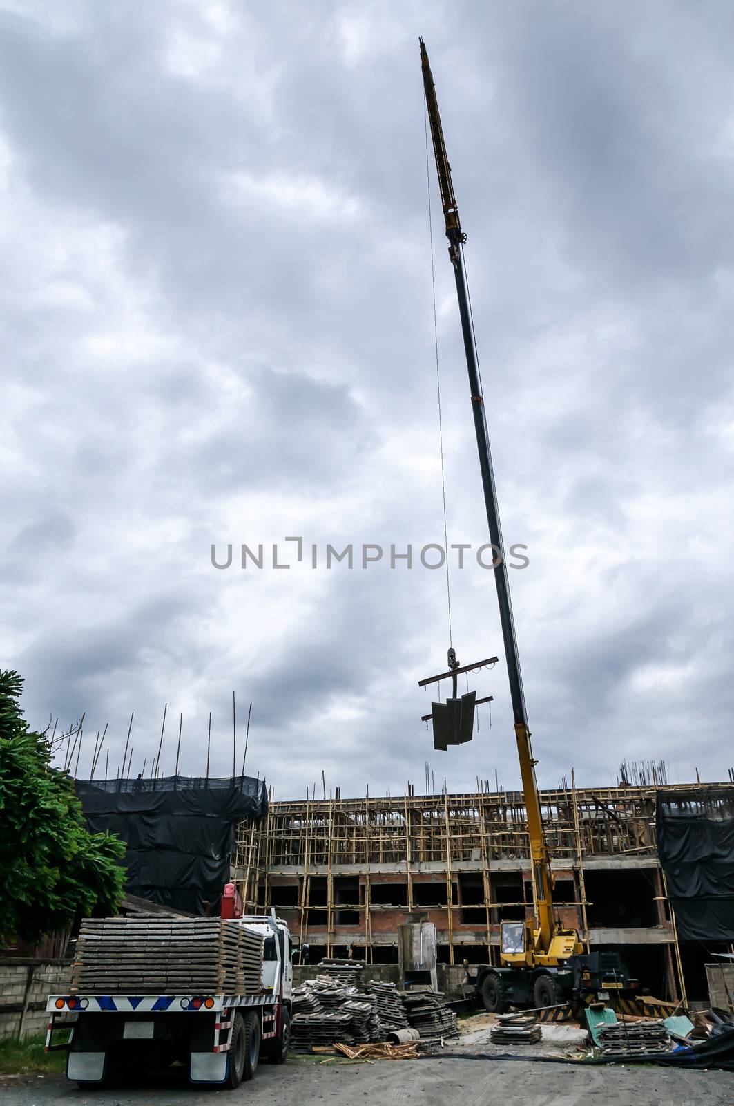 Crane hoist concrete plate by NuwatPhoto