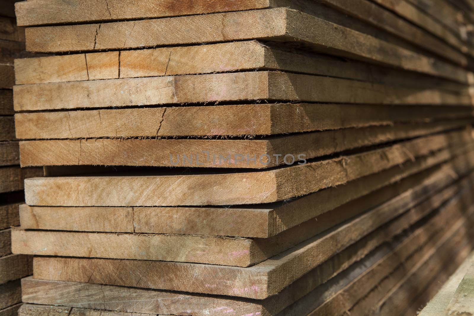 stack of wood grain for construction by khunaspix