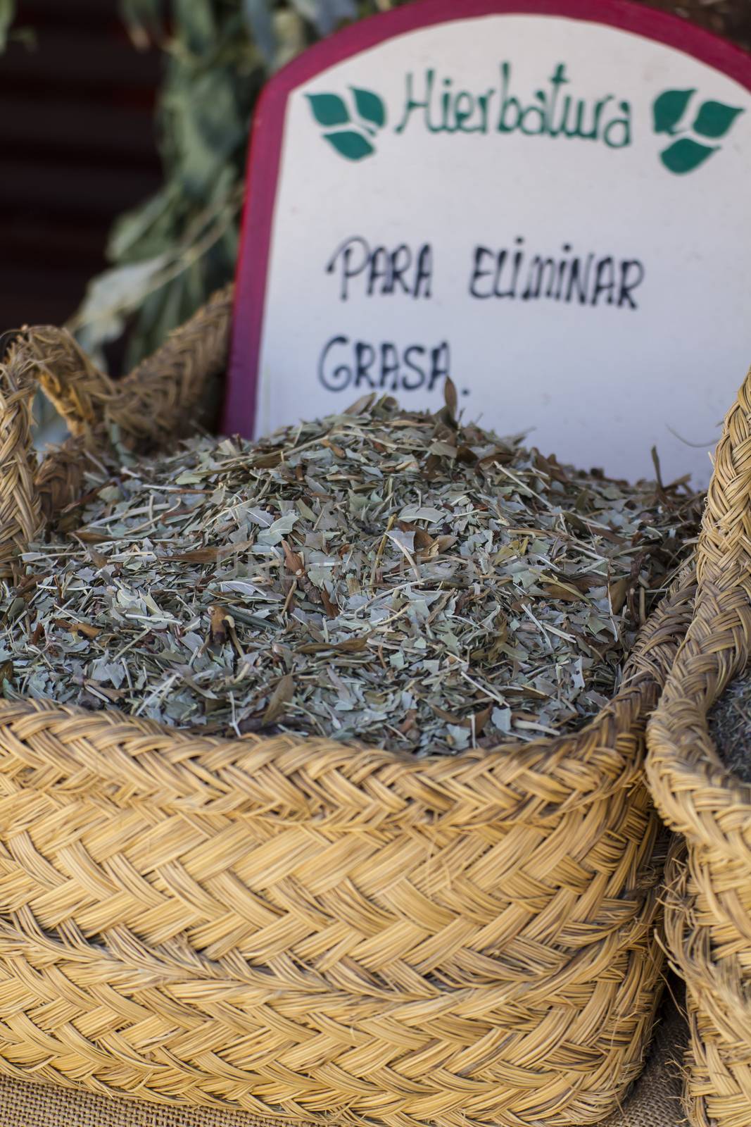 Healthcare, wicker baskets stuffed medicinal healing herbs by FernandoCortes