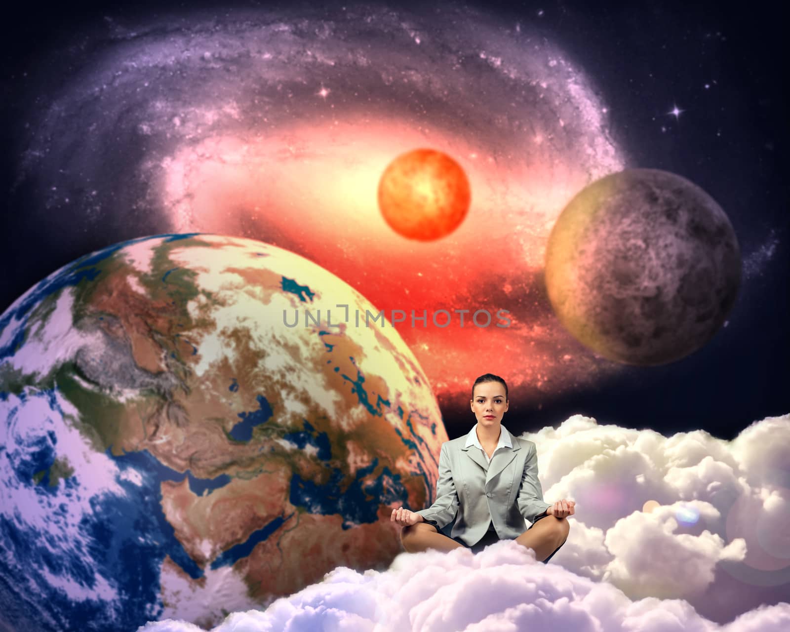 image of a businesswoman meditating in the clouds in space. Elements of this image furnished by NASA