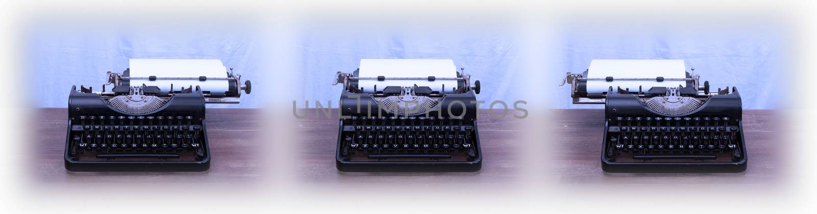 Old typewriter on wooden table by michaklootwijk