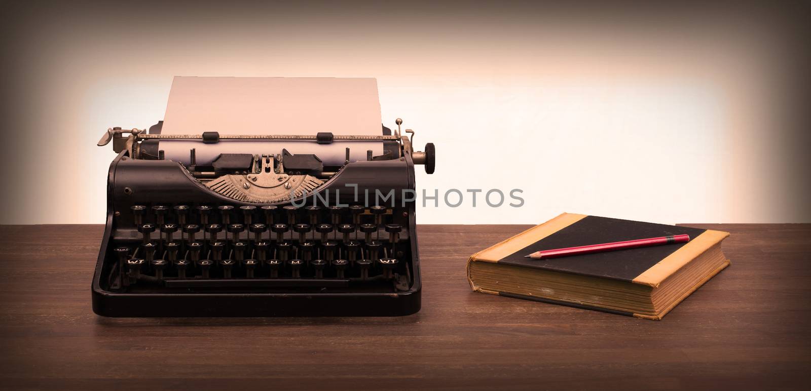 Vintage typewriter and old books, touch-up in retro style