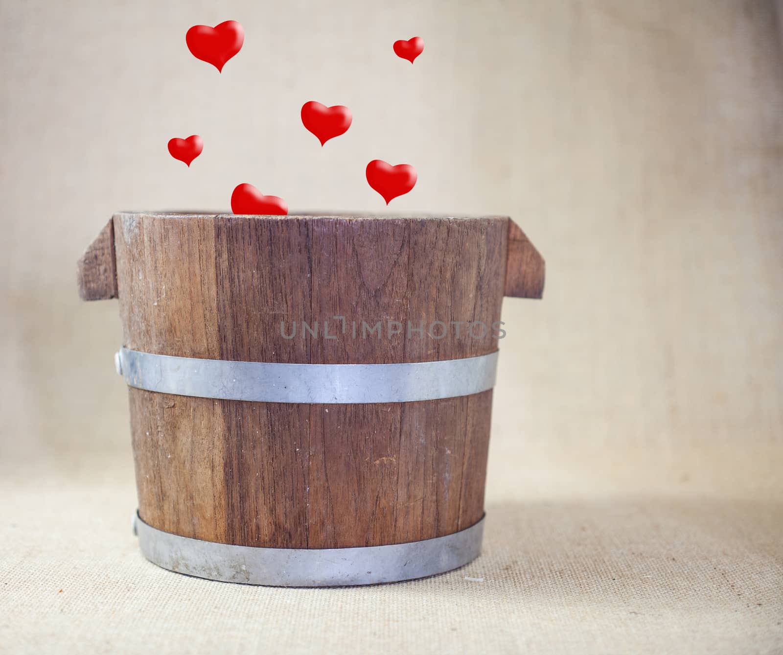 Hearts Drop in Wooden Bucket .