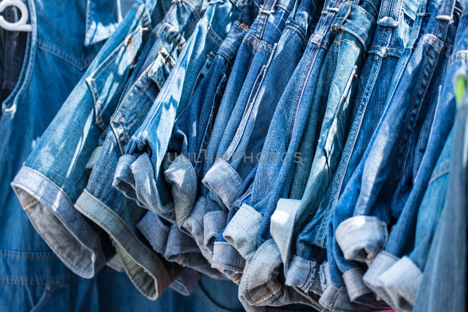 jeans hanging on hangers by Yuri2012