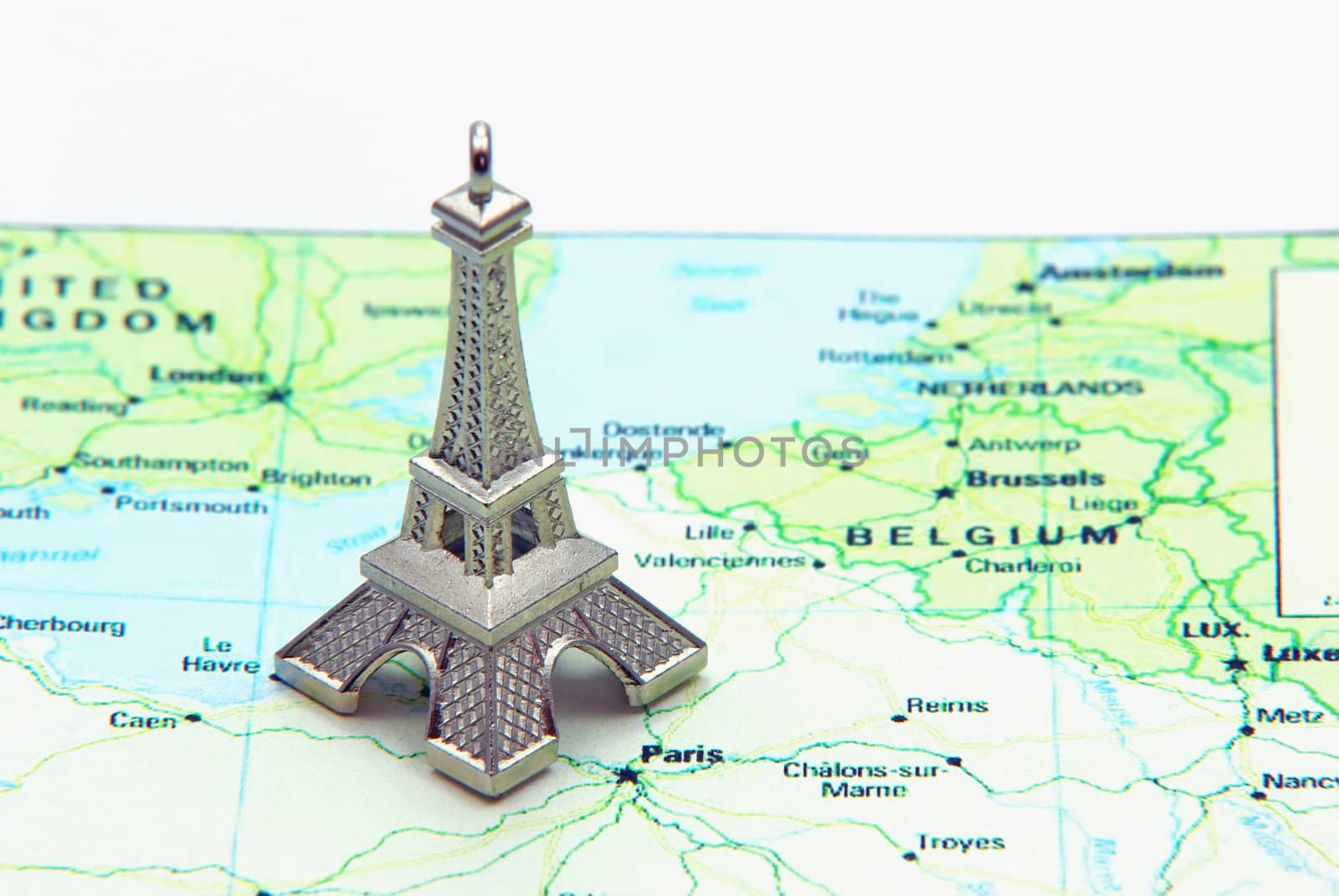 Statue of Eiffel Tower on a map of France