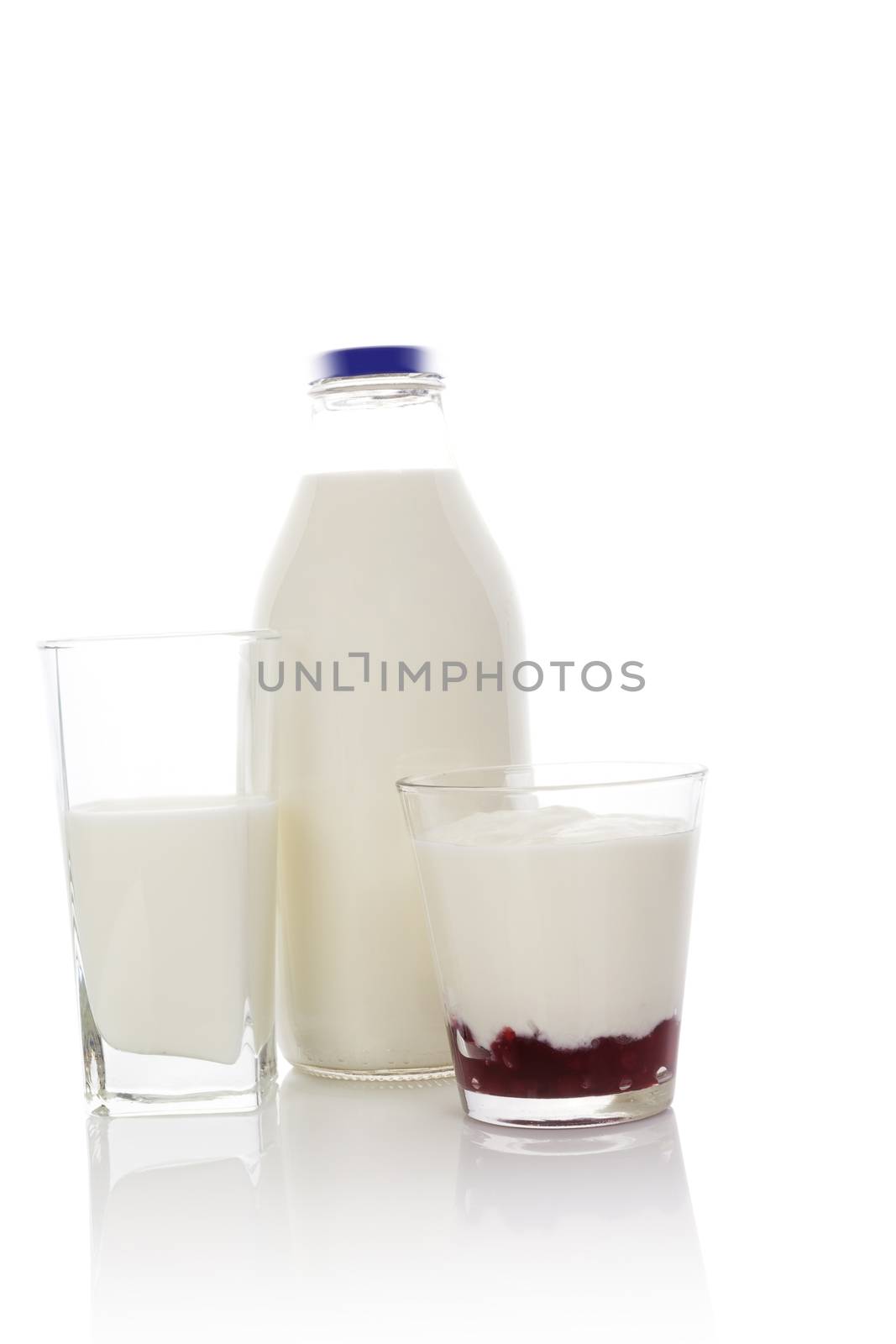 Dairy products isolated on white background. Milk bottle, milk in glass and yogurt. Minimal modern contemporary style. 