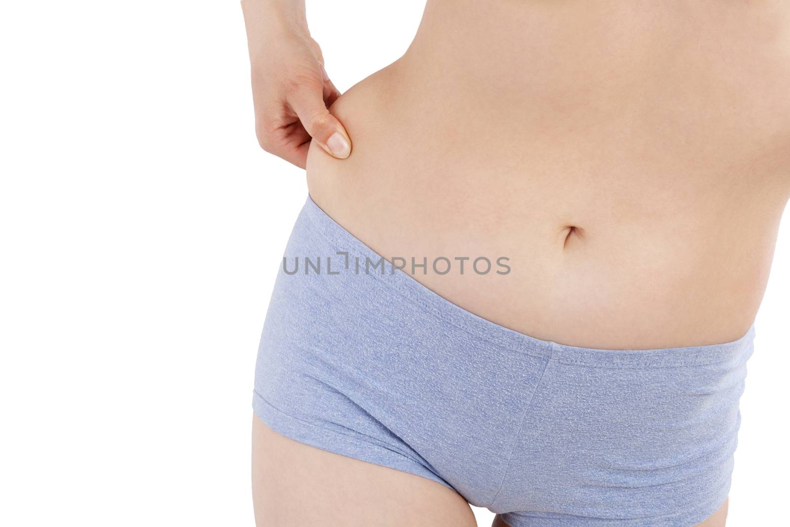 Weight loss, diet and body fat. Sexy woman in underwear making showing body fat and her hips isolated over white background. 