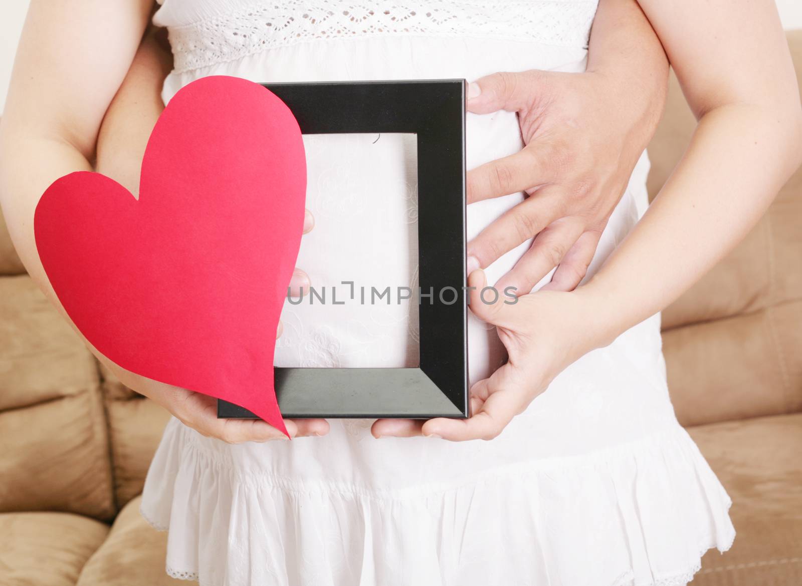 pregnant women with her husband waiting for her baby