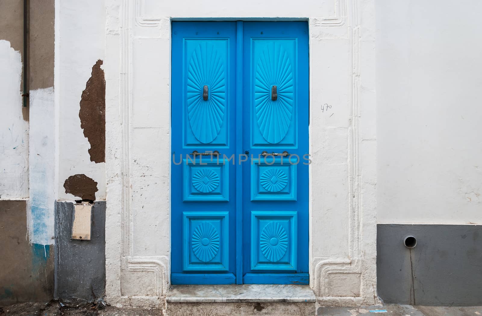 the front door of the old, dirty house