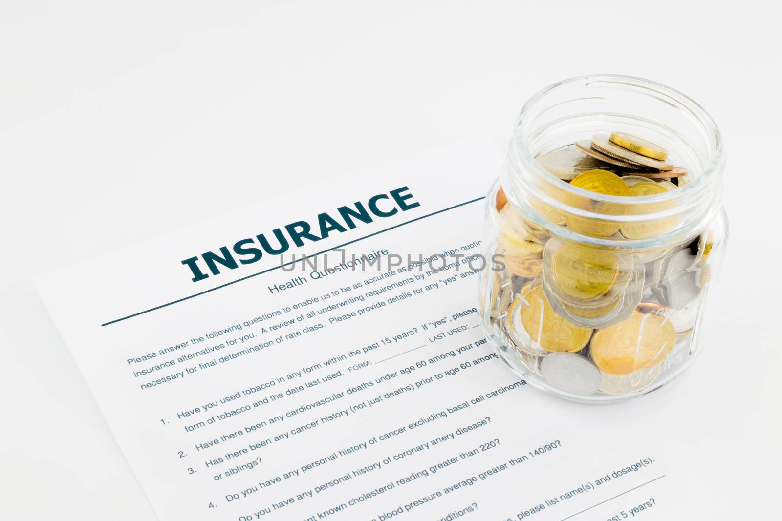 insurance health questionnaire and coins by vinnstock