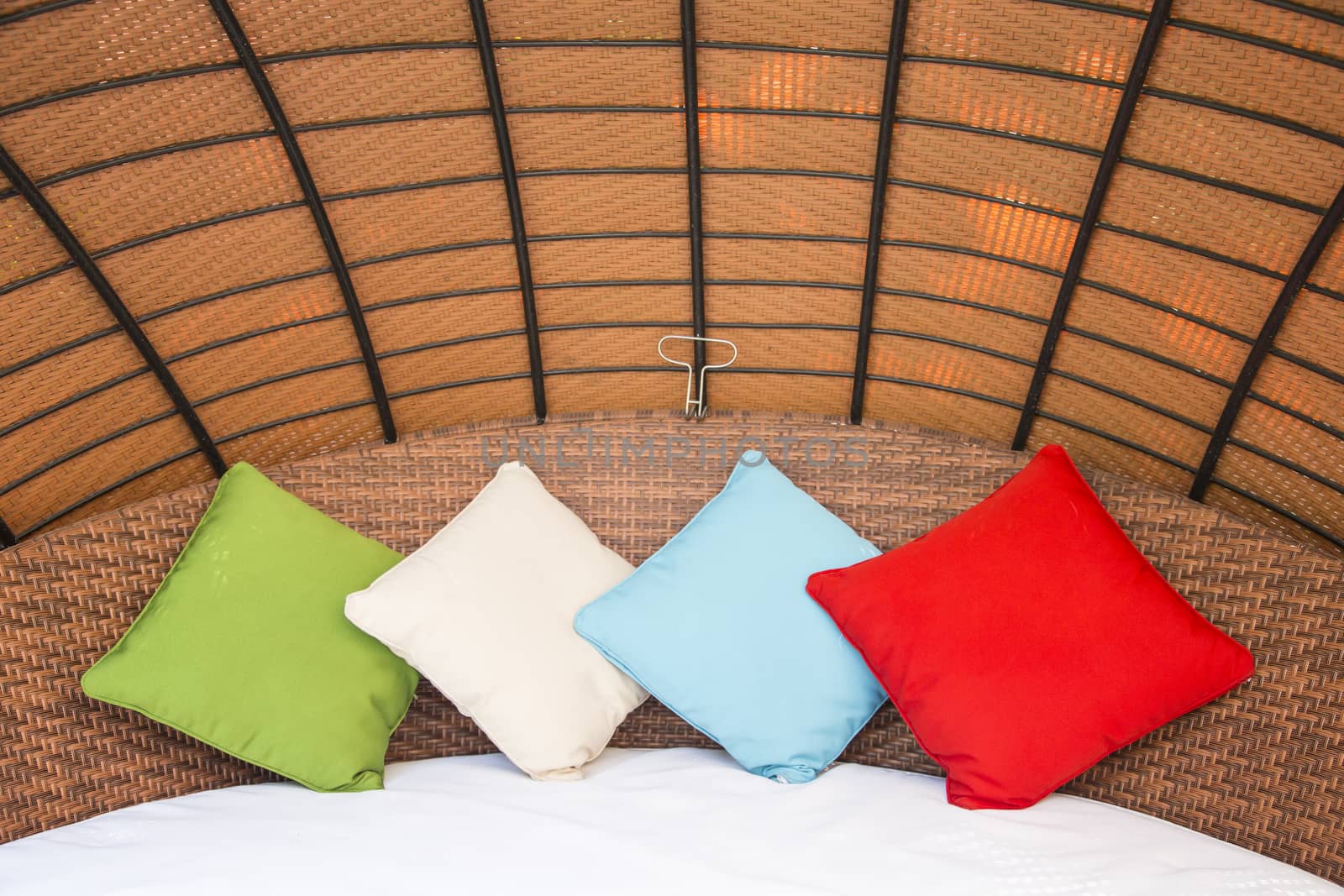 Colorful Pillow on hotel bed with space for text by 2nix