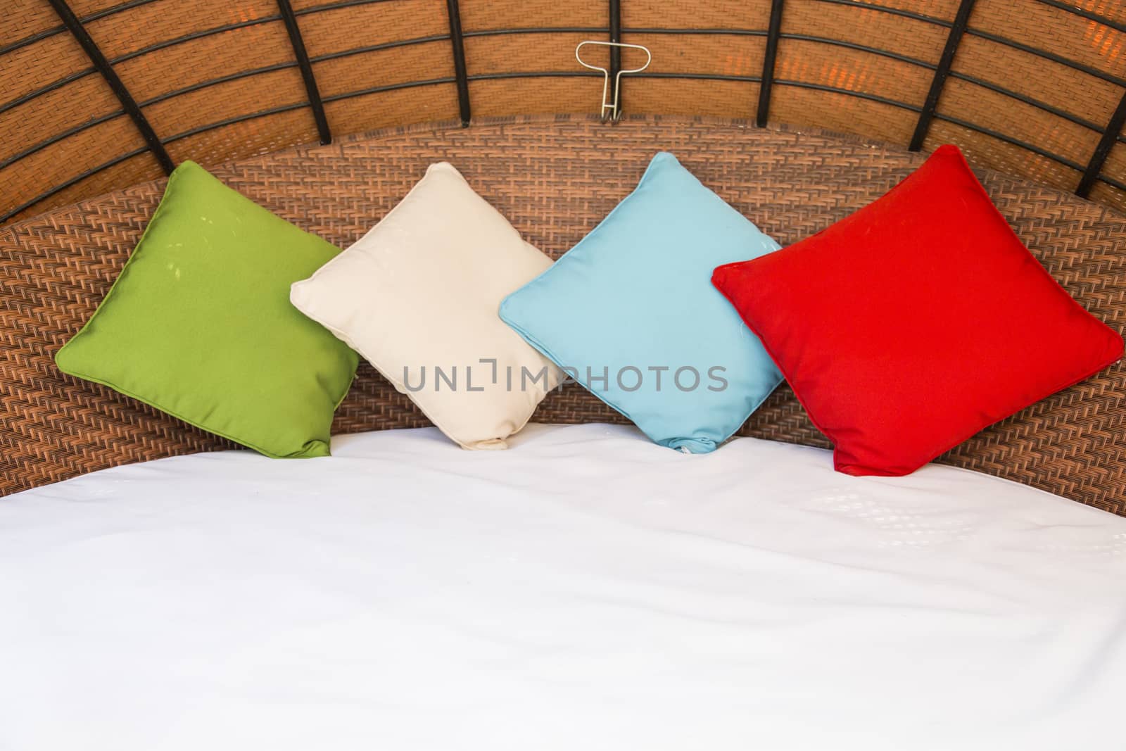 Colorful Pillow on hotel bed with space for text by 2nix