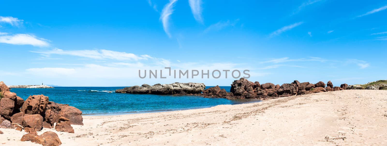 beach near the city of castelsardo in a sunny day