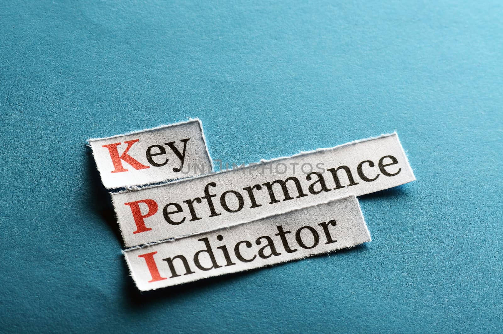 key performance indicator, KPI  on blue paper