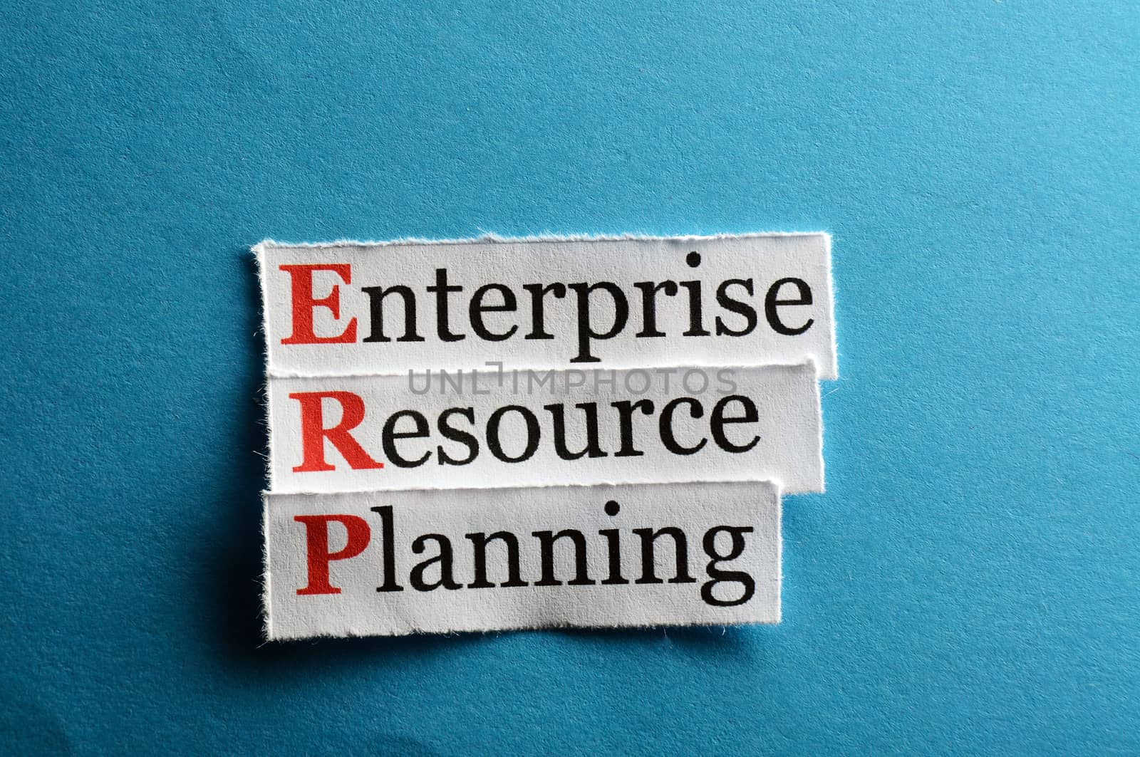 erp - enterprise resource planning on blue paper