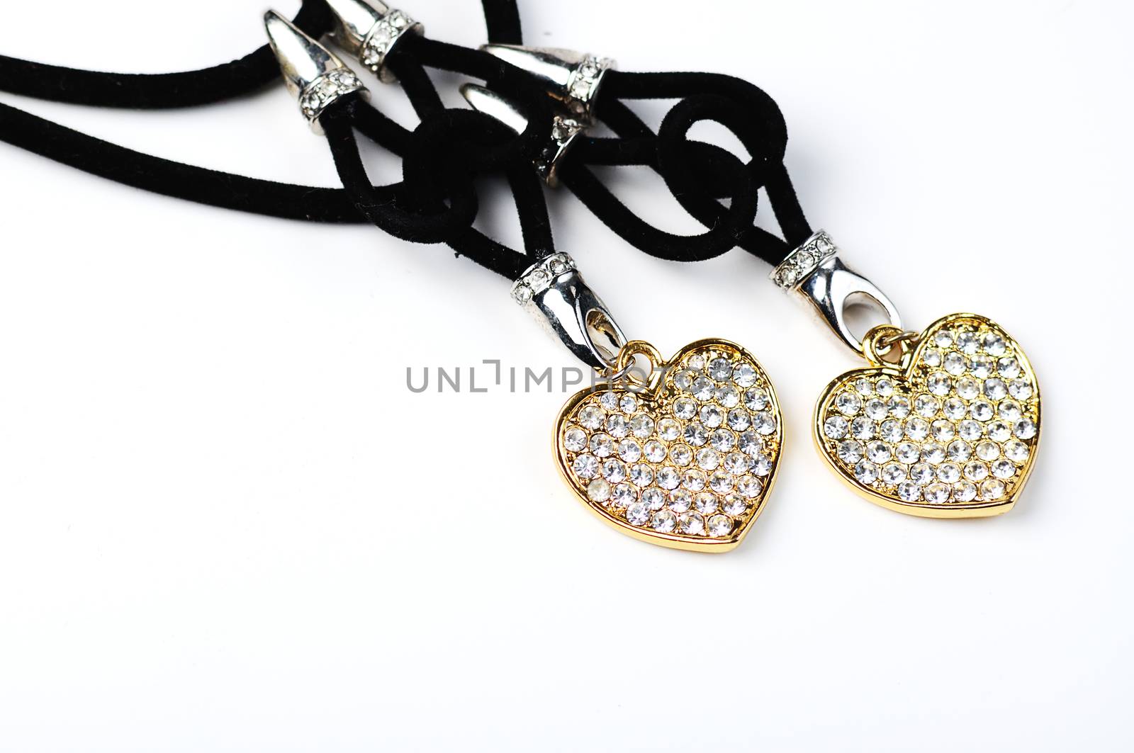 Beautiful  necklace with two hearts  closeup on white background  and space for text