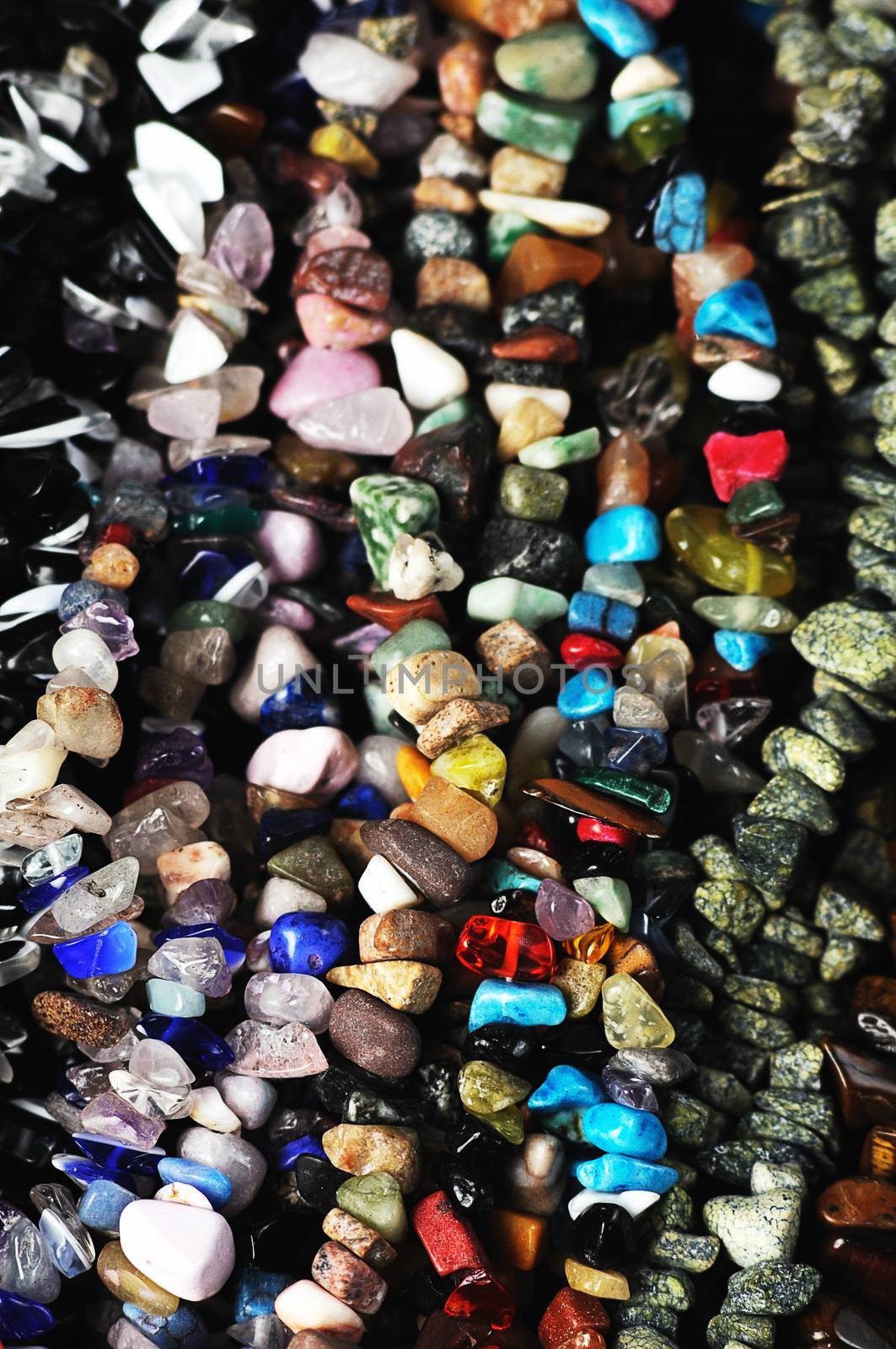 heap of variocolored  natural gem  stones,suitable for backgrounds.