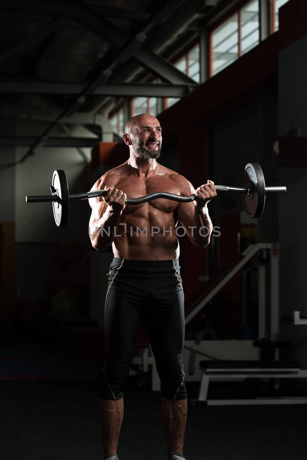 Mature Bodybuilder Working Out Biceps by JalePhoto