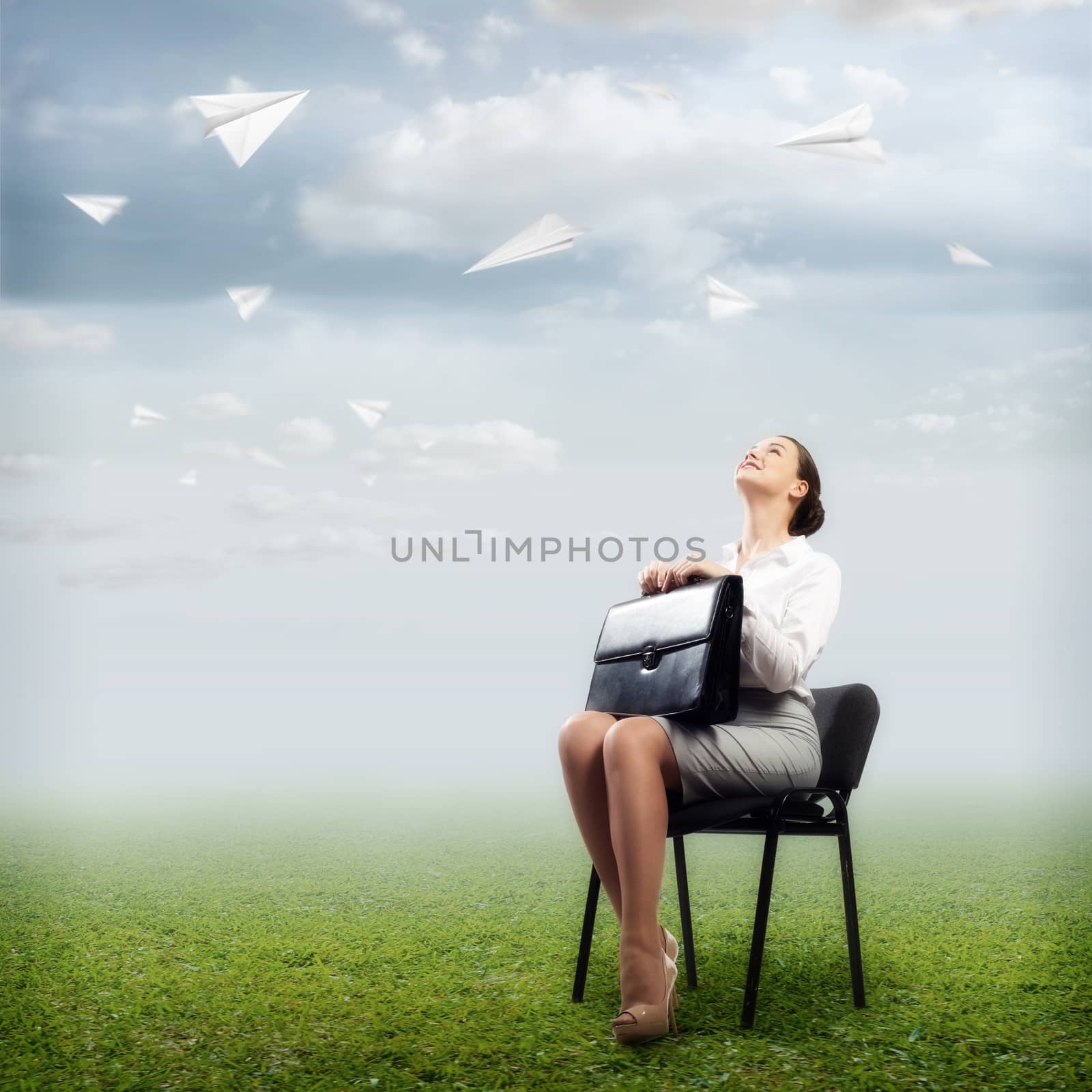 image of a business woman looking at the falling paper