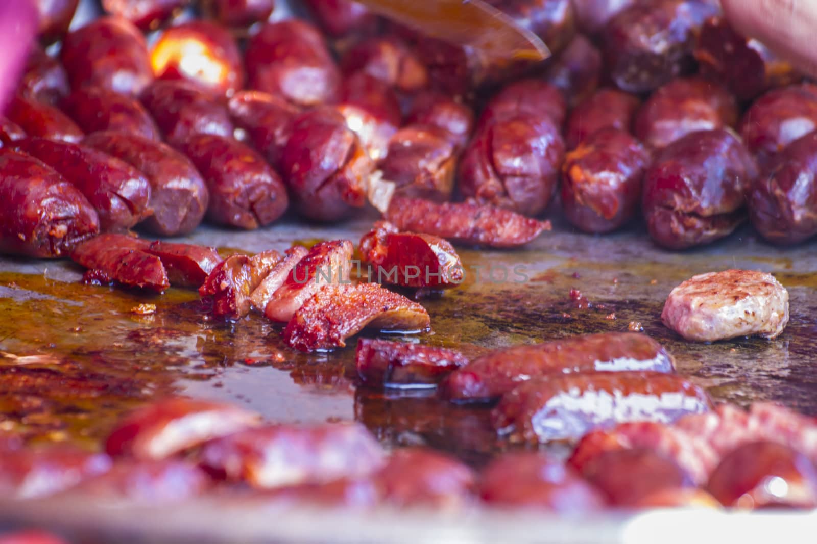 Grilled artisan sausages in a medieval fair