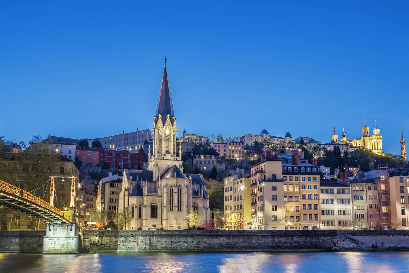 Famous Saint-Georges church in Lyon with Saone river at night 