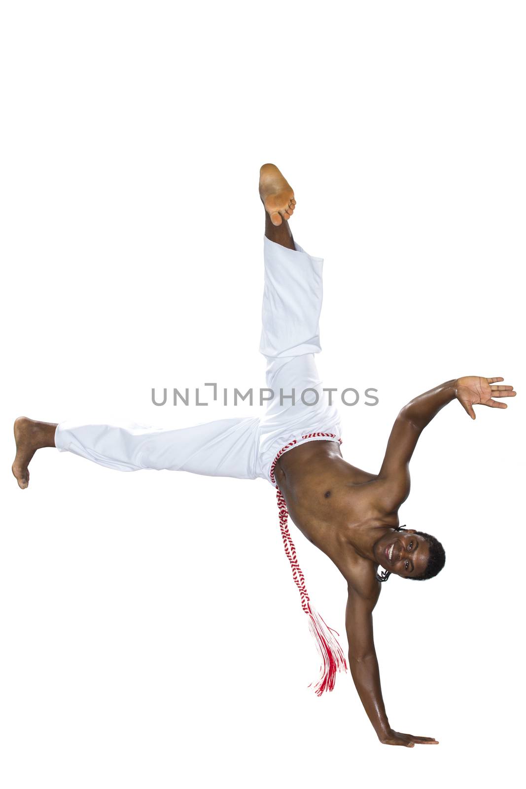 Capoeira, Brazilian Man standing on one hand, white pants by BrazilPhoto