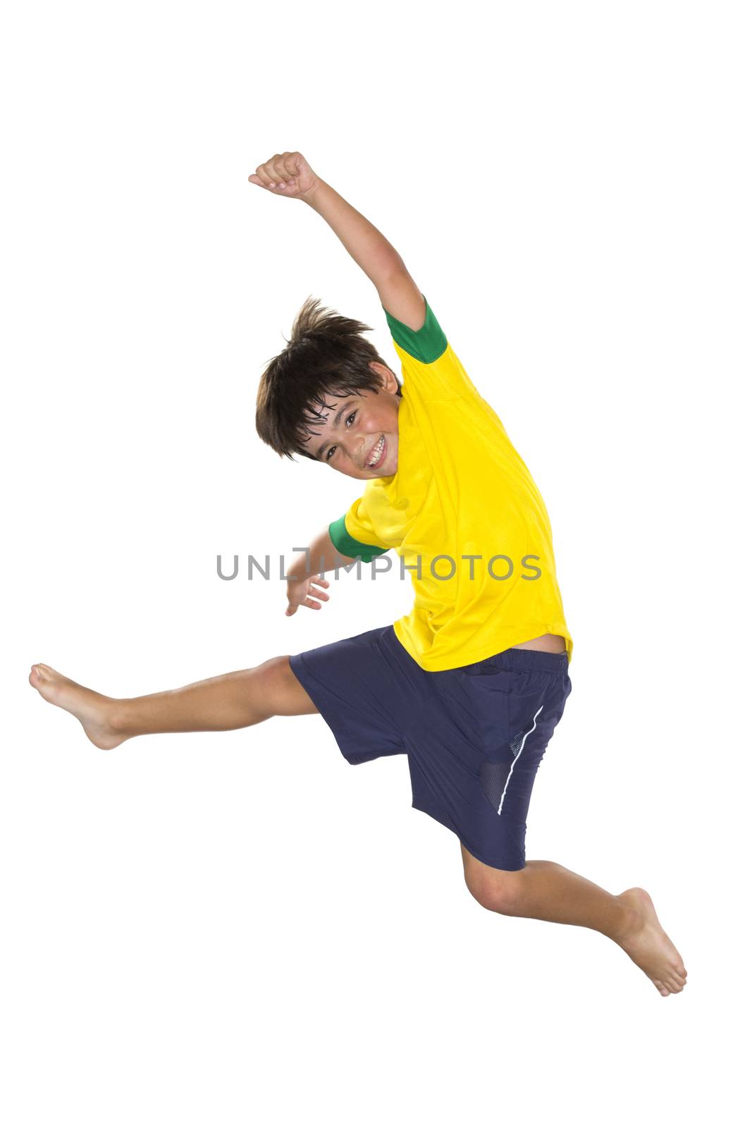 Brazilian Boy, jumping, yellow and blue by BrazilPhoto