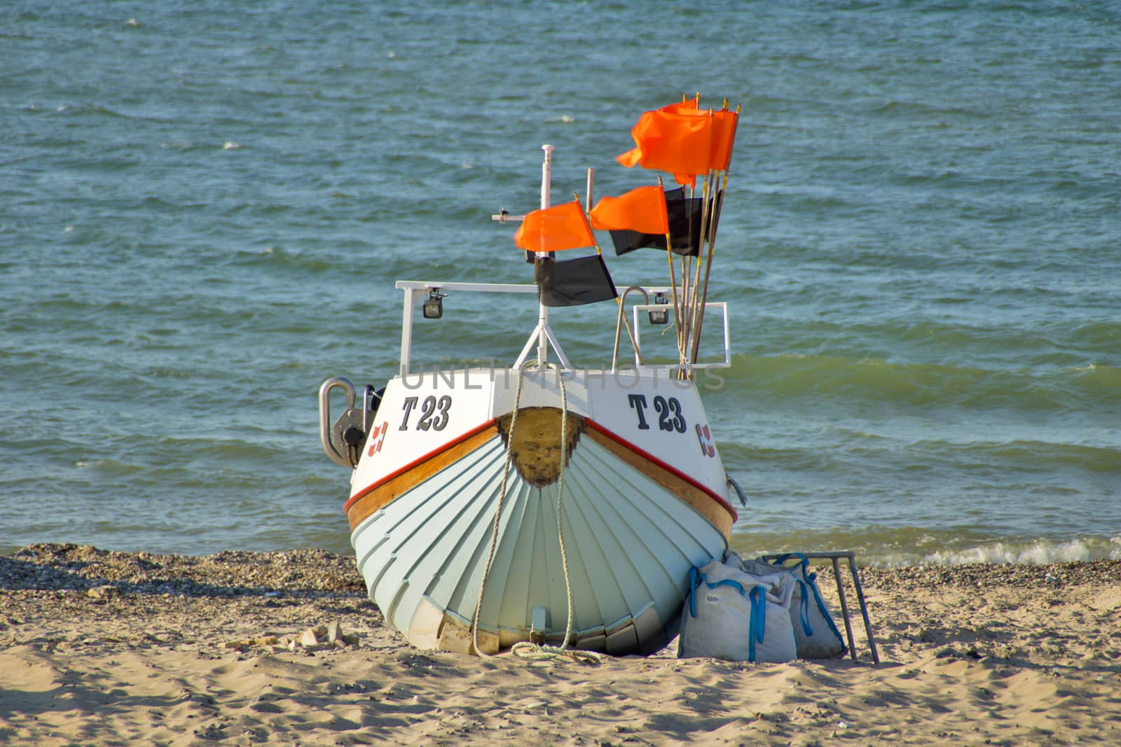 A fishing boat on the beach.