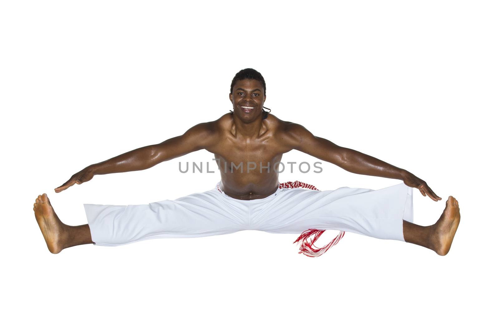 Capoeira, Brazilian Man jumping, dressed in white. by BrazilPhoto