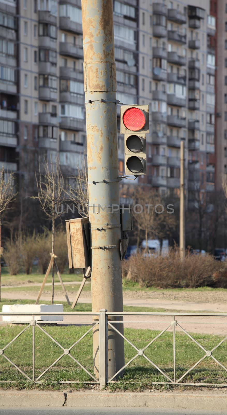 red light on the background of a multistory building